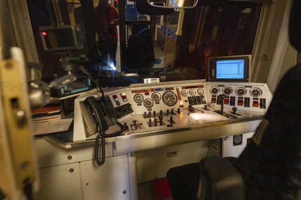 Train driver stand at night, illuminated controls and monitors with an insight into the technology sector, historic event, first test drive with a passenger train on the Hermann tracks, Hesse Railway since 1988, Calw district, Germany