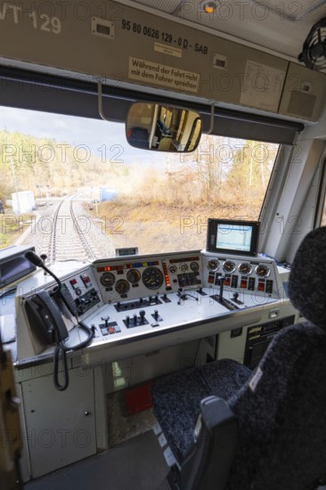 View from the train driver's cab on rails, with complex control panel and technology in the foreground, historic event, first test run with a passenger train on the Hermann tracks, Hesse Railway since 1988, Calw district, Germany