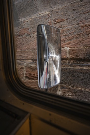 View through a train window of an exterior mirror reflecting the tunnel wall, historic event, first test run with a passenger train on the Hermann tracks, Hesse Railway since 1988, Calw district, Germany