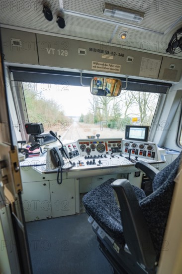 Driver's cab of a train with control elements and screens, view of tracks outside, historic event, first test run with a passenger train on the Hermann tracks, Hesse Railway since 1988, Calw district, Germany