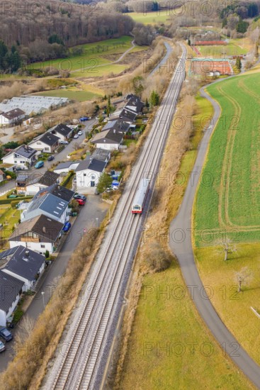 Station on a bend, surrounded by trees and fields near a settlement, historic event, first test run with a passenger train on the Hermann tracks, Hesse railway since 1988, Ostelsheim, Calw district, Germany
