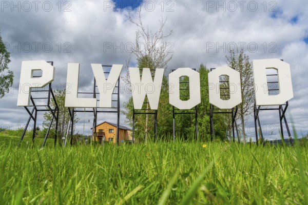 Sculpture, art installation Plywood in the form of Hollywood lettering by artist Jay Gard, Purple Path art and sculpture trail of the European Cultural Region around the cultural capital Chemnitz, Olbernhau, Ore Mountains, Saxony, Germany