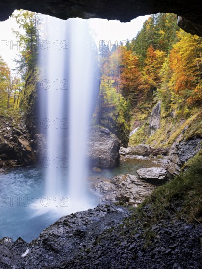 Waterfall mountain list in autumn-colored surroundings, Linthal, Klausenpass, Canton of Glarus, Switzerland