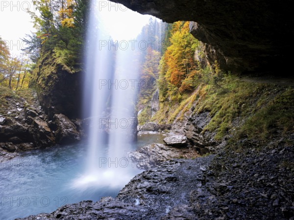 Waterfall mountain list in autumn-colored surroundings, Linthal, Klausenpass, Canton of Glarus, Switzerland