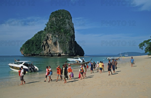 Rocks in the sea, boats and people on Pranang Cave beach, two years in front of the tsunami, Krabi, Thailand, December 2002, vintage, retro, old, historic