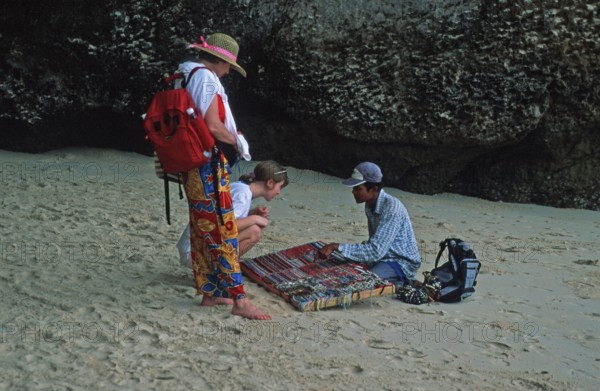 Jewelry sellers and customers on Pranang Cave beach, two years in front of the tsunami, Krabi, Thailand, December 2002, vintage, retro, old, historic