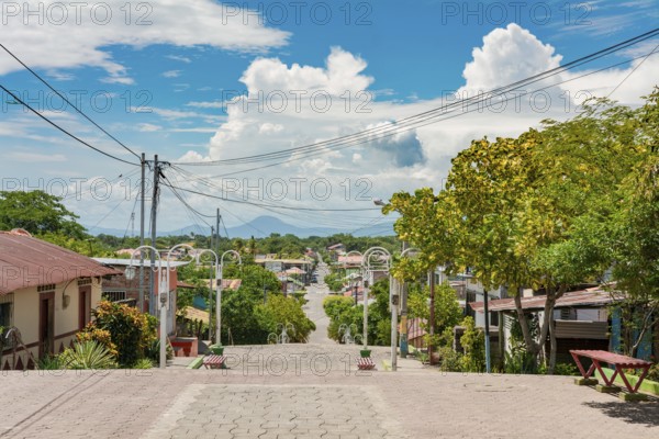 Streets of Nagarote with a view of the momotombo volcano on a suny day. View of the streets of Nagarote with a view of the Momotombo volcano, Nicaragua