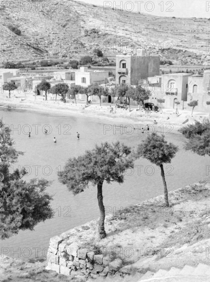 Xlendi Beach, Island of Gozo, Malta, Europe, 1956 thought to be British servicemen on the beach and in sea