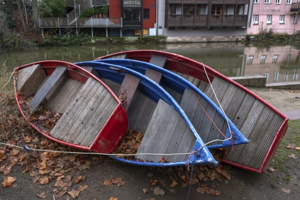Assembled rowing boats on the banks of Pegnitz, river in Nuremberg, Middle Franconia, Bavaria, Germany
