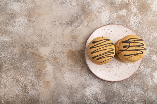 Caramel Cream Cakes on brown concrete background, top view, flat lay, copy space