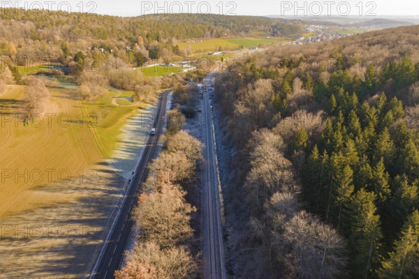Aerial view of a railway line between trees and a road in a rural area, construction of the Hermann Hesse Railway, Calw, Germany