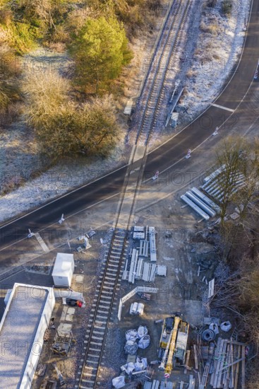 Construction site on a railway line with building materials next to a road, construction of the Hermann Hesse Railway, Calw, Germany