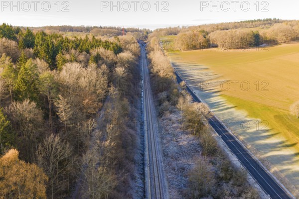 Railway line between trees and a country road surrounded by nature, construction of the Hermann Hesse Railway, Calw, Germany