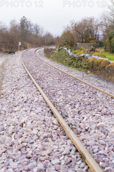Close-up of a winding railway line with rails and gravel, construction of the Hermann Hesse Railway, Calw, Germany