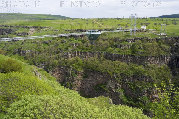 Landscape with bridge over deep gorge surrounded by green vegetation, diamond bridge, Diamond Glass Bridge, world's longest free-hanging structure, Dashbashi Gorge, Khrami River, Tsalka Nature Reserve, Kartli, Georgia