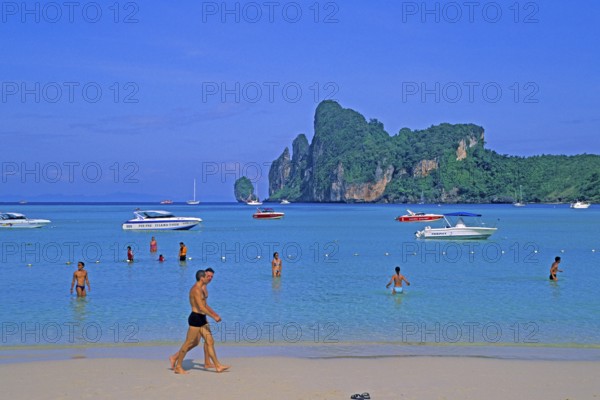 People, boats on the beach of Ko Phi Phi Don, two years in front of the tsunami, Thailand, December 2002, vintage, retro, old, historic
