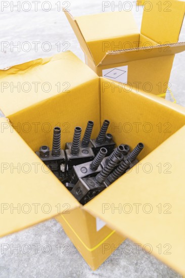 Open boxes with black charging stations inside, parking garage construction with charging infrastructure, Calw, Germany