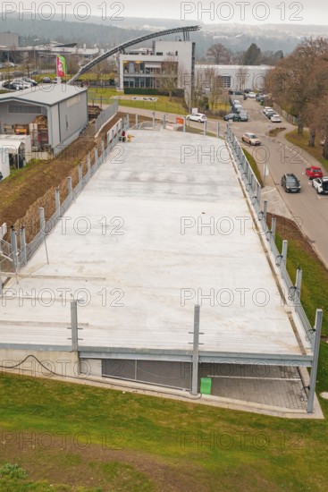 Today's view of an empty parking lot in an urban area, parking garage construction with charging infrastructure, Calw, Germany