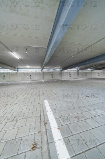 Empty interior of a parking garage with concrete walls and ceiling, parking garage construction with charging infrastructure, Calw, Germany