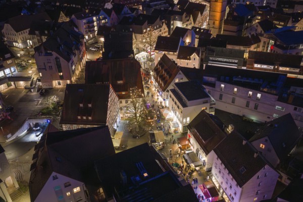 Illuminated streets and buildings of a city in a nocturnal, wintery atmosphere, Weihnachtsmark Nagold, LandkreiScalw, Germany