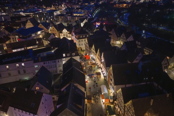 Aerial view of an atmospheric city at night with illuminated streets and houses, Weihnachtsmark Nagold, Landkreis Calw, Germany
