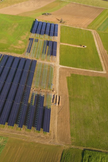 Bird's-eye view of solar panels on green fields in a rural area, Energiewende, construction of PV open space, Baden-Württemberg, Germany