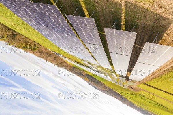 Diagonally arranged solar modules on green fields for energy generation, energy transition, construction of PV open space, Baden-Württemberg, Germany
