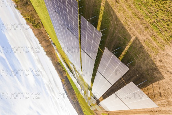 Rows of solar modules in a green environment, technology for clean energy, energy revolution, construction of PV open space, Baden-Württemberg, Germany