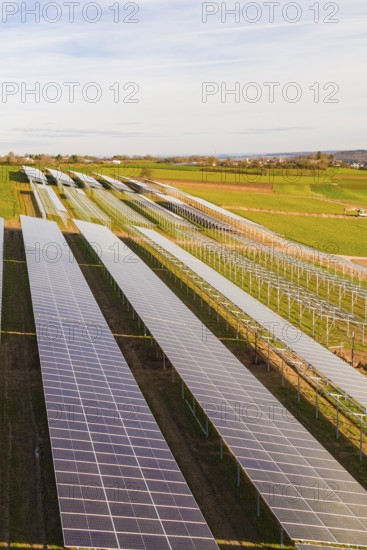 Numerous solar modules cover fields in rural countryside, energy transition, construction of PV open space, Baden-Württemberg, Germany