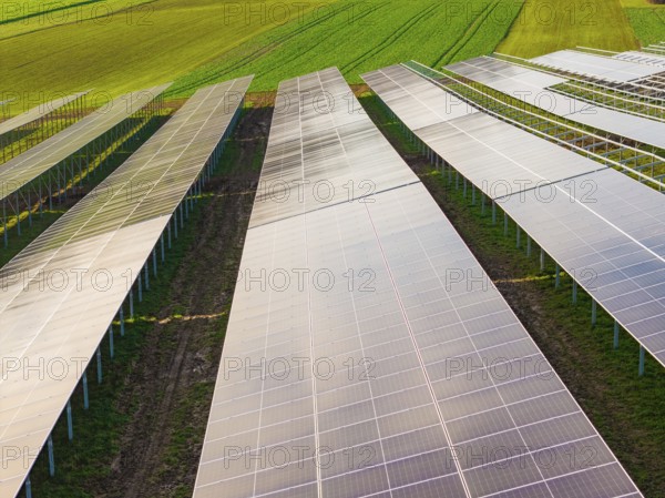 Close-up of solar systems spanning fields, energy transition, construction of PV open space, Baden-Württemberg, Germany