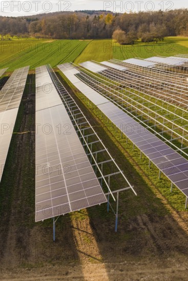 Solar cells on metal frames in a rural area, energy revolution, construction of PV open space, Baden-Württemberg, Germany