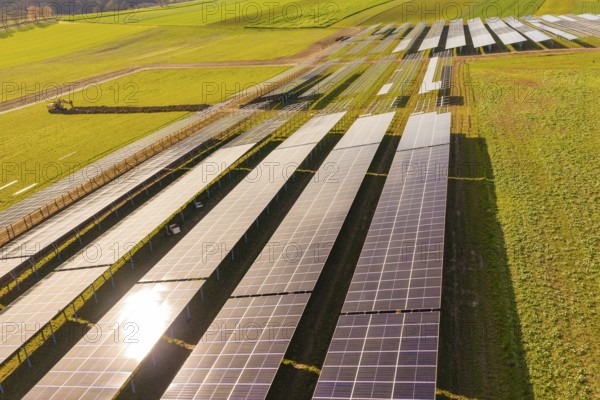 Rows of solar panels on agricultural fields under sunny skies, Energiewende, construction of PV open space, Baden-Württemberg, Germany