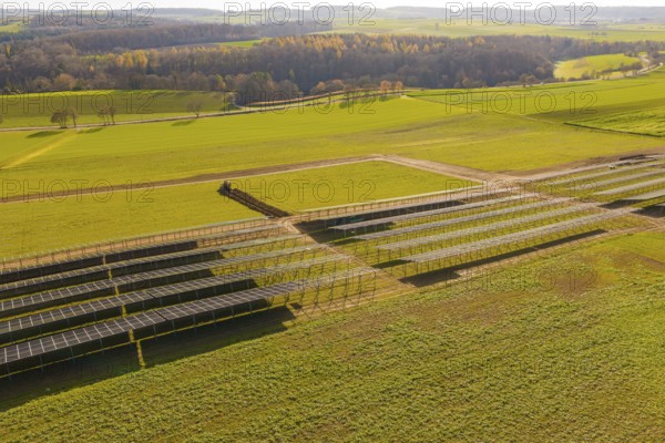 Incomplete solar panel structures on a green area in a vast landscape, energy revolution, construction of PV open space, Baden-Württemberg, Germany