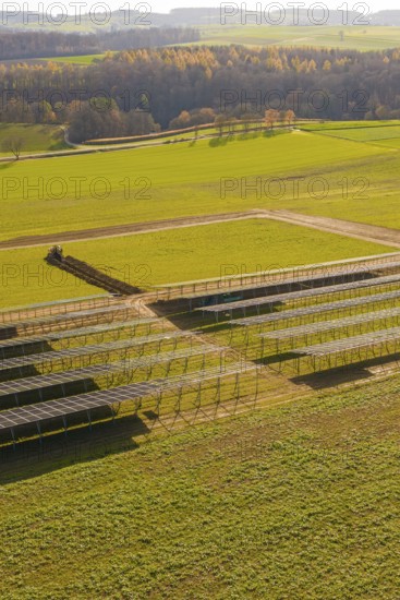 Incomplete solar park with empty structures and green land in autumn, energy revolution, construction of PV open space, Baden-Württemberg, Germany