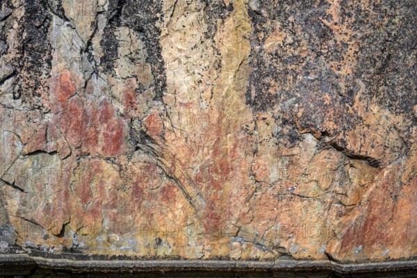 Prehistoric rock art in reddish brown on a textured surface Rock paintings of Värikallio, rock wall above Somerjärvi, Hossa National Park, Suosalmi, Finland, EuroParni, Peranka, Kainuu, Finland