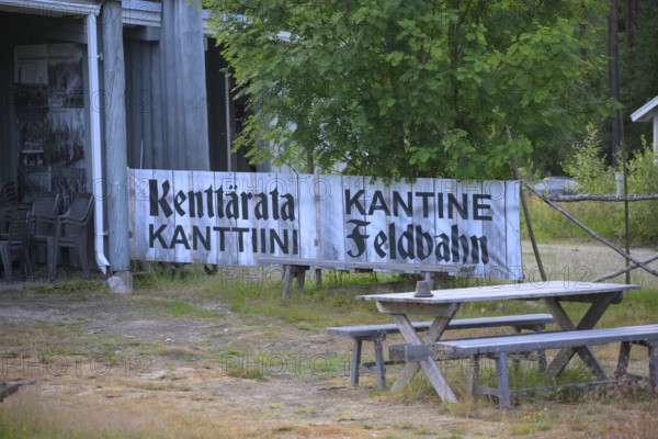 Wooden sign with the inscription Kantine Feldbahn Gedenkstätte Winterkrieg H, Kotiranta, Ala-Vuokki, Suosalmi, Finland