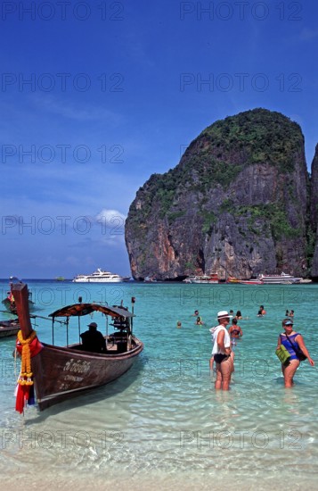 People, longtail boat on Maya Bay beach, known from the movie The Beach, one year in front of the tsunami, Ko Phi Phi Le, Thailand, December 2002, vintage, retro, old, historic