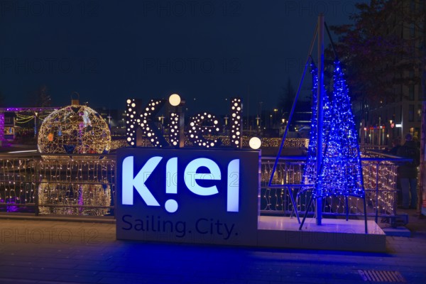 Christmas decoration in Kiel am Holstenfleet, Kleiner Kiel Canal, city center, Christmas, lighting, lights, sailboats, stars, lettering, tree ball, water reflection, evening, darkness, Germany