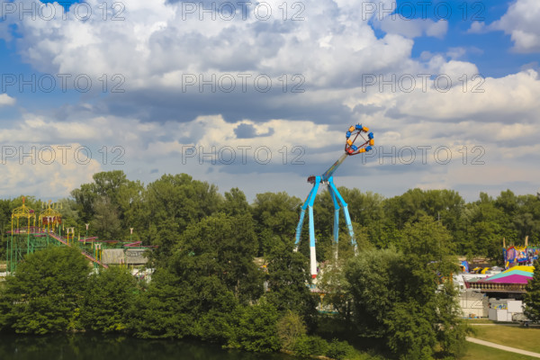 Fairground in Ulm Friedrichsau, folk festival, hustle and bustle, amusement park, amusement attraction, ride, blue sky, clouds, artistico the largest transportable swing in the world, Ulm, Baden-Württemberg, Germany
