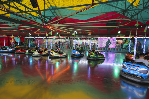 Bumper car, autodrome, bumper cars, boxing car, self-driver, fairground in Ulm Friedrichsau, public festival, hustle and bustle, ferris wheel, amusement park, amusement attraction, ride, clouds, Ulm, Baden-Württemberg, Germany