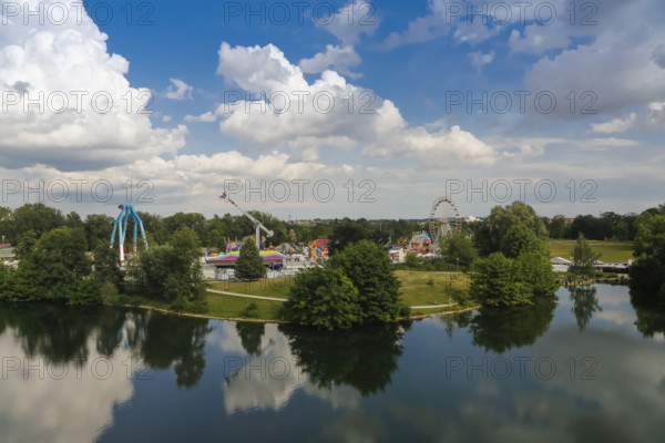 Fairground in Ulm Friedrichsau, folk festival, hustle and bustle, ferris wheel, amusement park, amusement attraction, ride, blue sky, clouds, natural lake, Ausee, Ferris wheel, Ulm, Baden-Württemberg, Germany