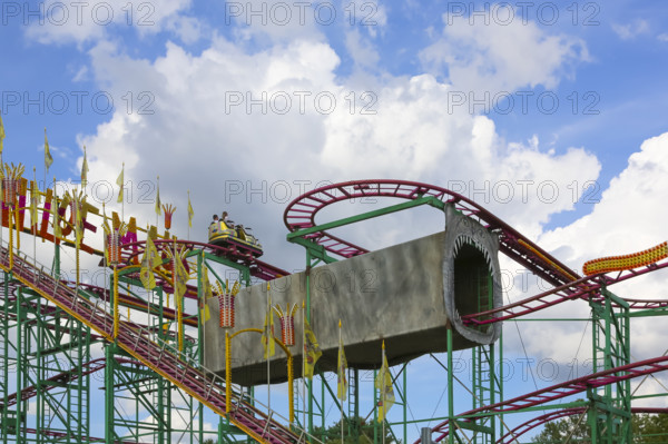Wilde Maus, little rollercoaster for children, fairground in Friedrichsau Ulm, public festival, hustle and bustle, fair, amusement park, amusement attraction, ride, blue sky, clouds, Ulm, Baden-Württemberg, Germany