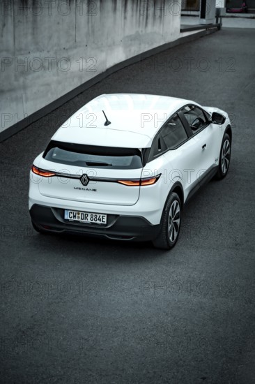 Rear view of a white modern SUV on a paved road, Deer e-car sharing, Renault Megane, Calw, Germany
