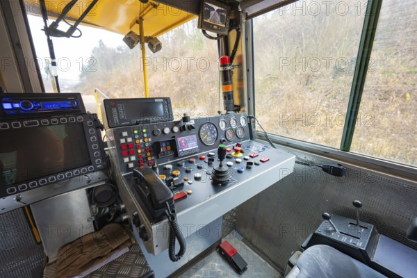 Interior view of a train driver's cab with numerous switch and control buttons, stuffing machine on Hermann, Hesse, Bahn, Althengstett, Calw district, Germany