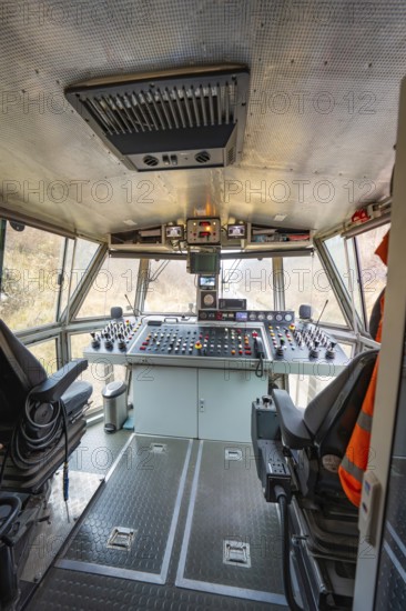 Spacious train driver's cab with comprehensive control panel and seating, stuffing machine on Hermann, Hesse, Bahn, Althengstett, Calw district, Germany