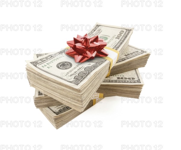 Stacks of one hundred dollar bills with red bow on top