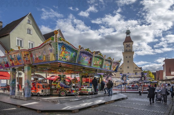 Children's carousel at the town festival on the market square, in the back the town hall, building from the 13th to 18th century, Unterer Markt, Hersbruck, Middle Franconia, Bavaria, Germany