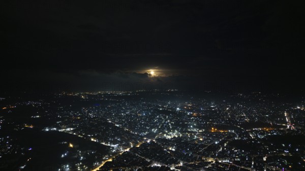 A Drone night view of Aleppo, Syria on December 19, 2025, showing illuminated streets, dense residential areas, and major traffic routes under the night sky, Aleppo, Aleppo, Syria