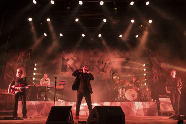 Bernd Römer (guitarist), Martin Becker (keyboarder), Claudius Dreilich (singer), Heiko Jung (drummer) and Daniel Bätge (bassist) from Karat live on 50 Years of KARAT Tour in Berlin's Max-Schmeling-Halle on 19 December 2025