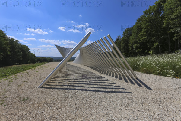 Art in public space, sculpture made of aluminum profile pipes by artist Martin Burchard, life's horizon path near Mundingen, light and shadow, gravel, clouds, blue sky, walk-in art, paths of reflection and refreshment on the Ehinger Alb, Baden-Württemberg, Germany
